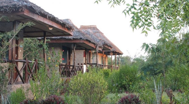 View of cottages and garden at Camp Bastian Mikumi
