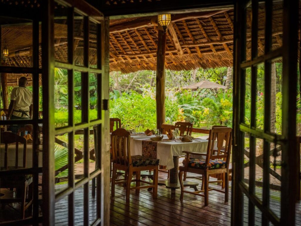 Luxurious villa exterior at Anna of Zanzibar with tropical garden and ocean glimpse