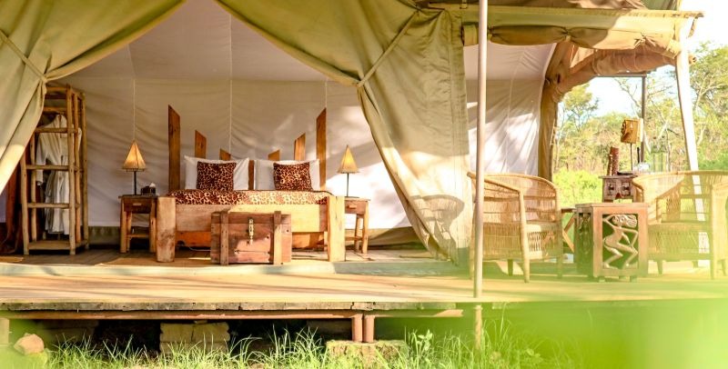 Interior of a culturally themed tent at Asanja Moru with African decor