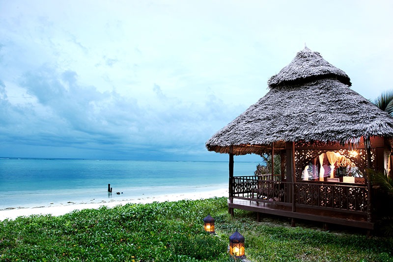 Outdoor lounging area with ocean views at Breezes Beach Club