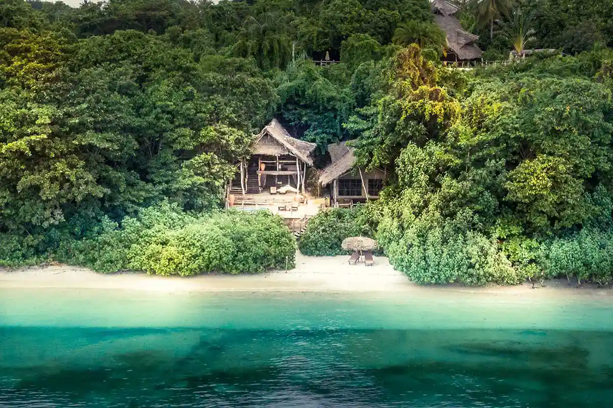 Interior of a luxurious tented suite with ocean view at Fundu Lagoon