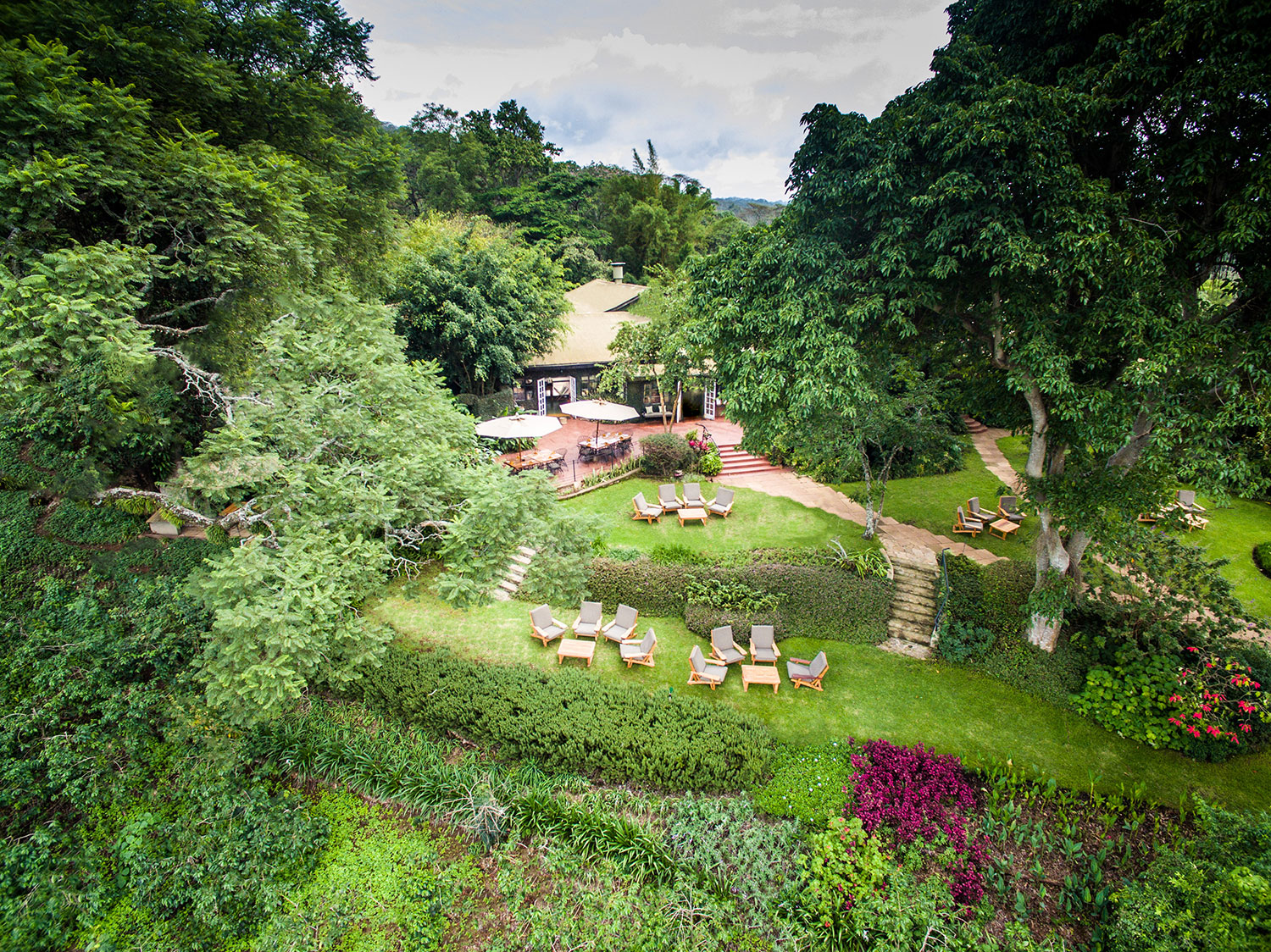 Guests enjoying farm-fresh meal with views of the gardens at Gibb's Farm