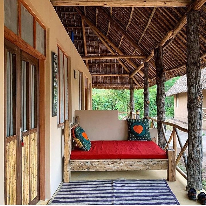 Modern interior of a spacious room at Mloka Safari Lodge with Swahili decor elements