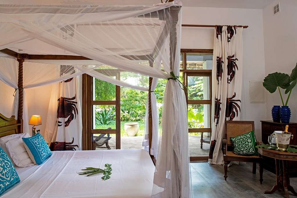 Enjoying the ocean breeze under palm trees on the pristine beach at Tikitam Palms