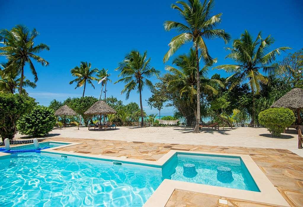 Enjoying the ocean breeze under palm trees on the pristine beach at Tikitam Palms