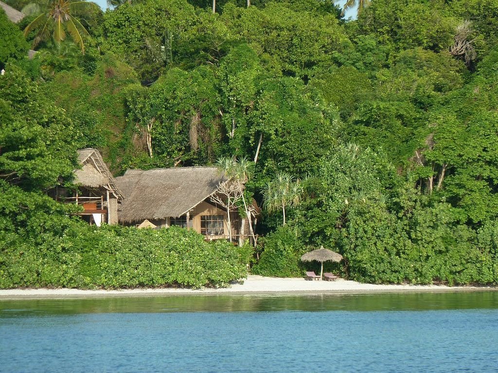 Interior of a luxurious tented suite with ocean view at Fundu Lagoon