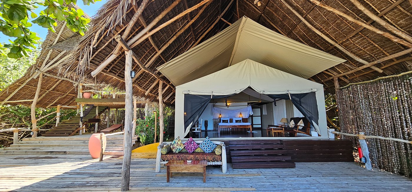 Private beach dinner setup at Fundu Lagoon, Pemba