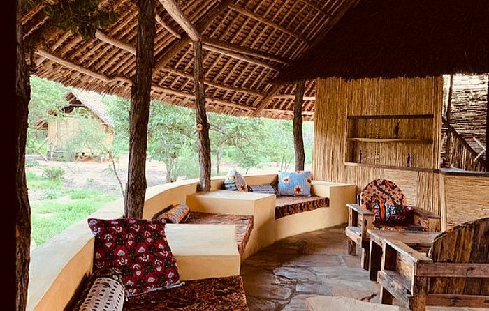 Relaxing atmosphere around the lodge, possibly near a pool or garden area