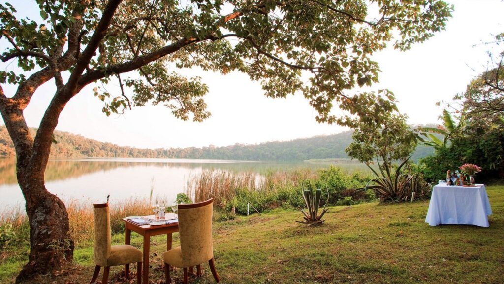 Serene view of a chalet and lush surroundings at Lake Duluti Lodge