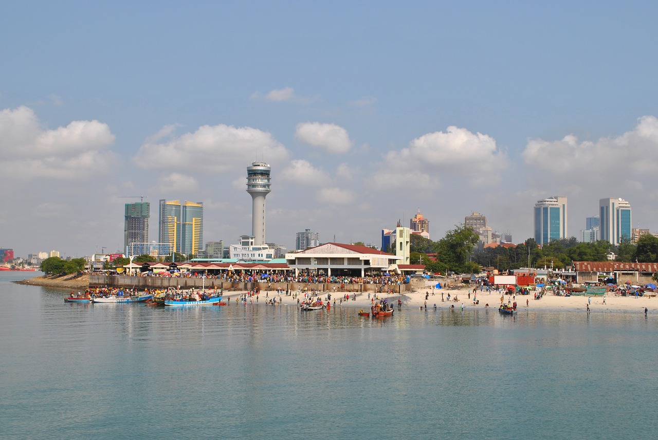 Skyline of Dar es Salaam with the Askari Monument in the foreground, overlooking the city.