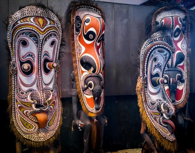 Close-up of vibrant Tinga Tinga paintings, a popular Tanzanian souvenir.